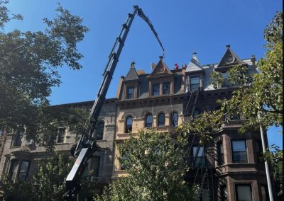 A roofing project involving a crane